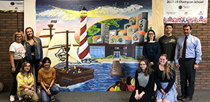 RBR senior studio art majors with their mural and their client, the RBR Superintendent.